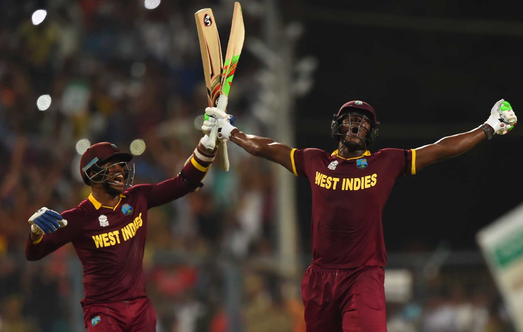 west indies 039 s carlos brathwaite r and teammate marlon samuels celebrate after victory in the world t20 cricket tournament final match between england and west indies at the eden gardens cricket stadium in kolkata on april 3 2016 photo afp