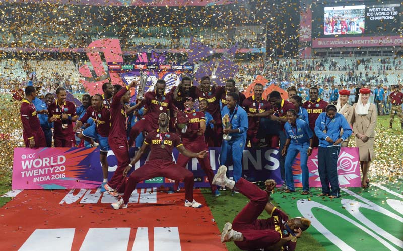 members of the west indies men s and women s teams celebrate their world t20 victories photo afp