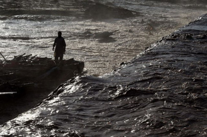 rescuers race to reach thousands stranded by rains in northern pakistan