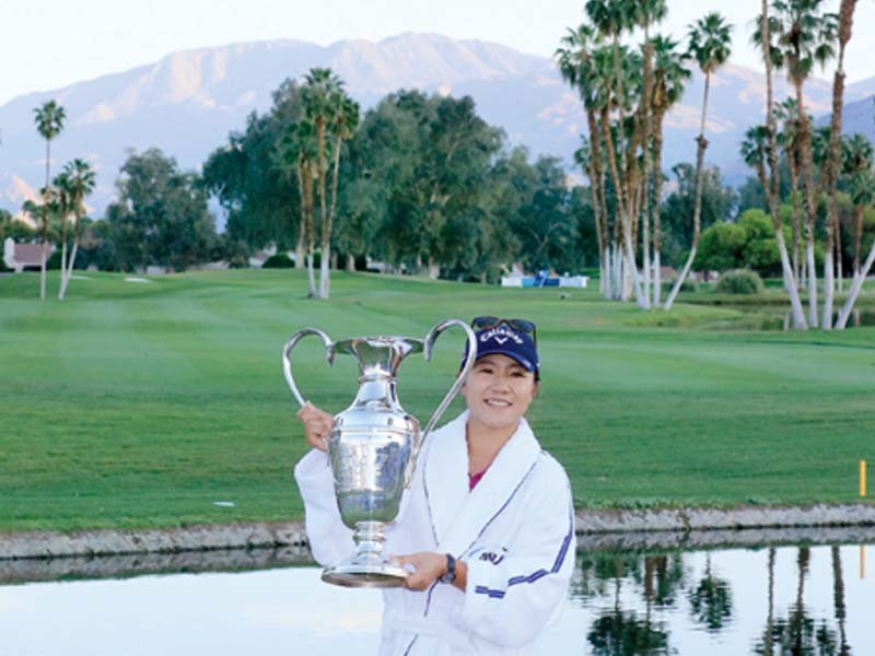 ko poses with the trophy after the final round of the ana inspiration at the mission hills country club photo afp