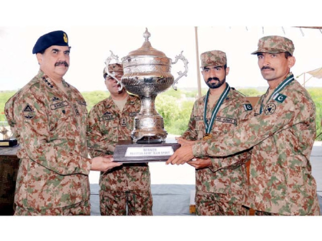 general raheel sharif awards the winning trophy to mangla corps for winning the pakistan army team spirit competition in pabbi on monday photo inp general raheel sharif awards the winning trophy to mangla corps for winning the pakistan army team spirit competition in pabbi on monday photo inp