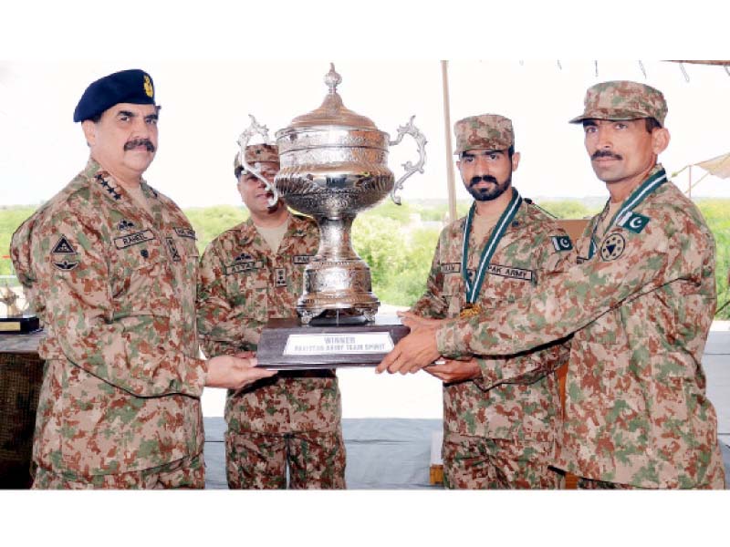 general raheel sharif awards the winning trophy to mangla corps for winning the pakistan army team spirit competition in pabbi on monday photo inp