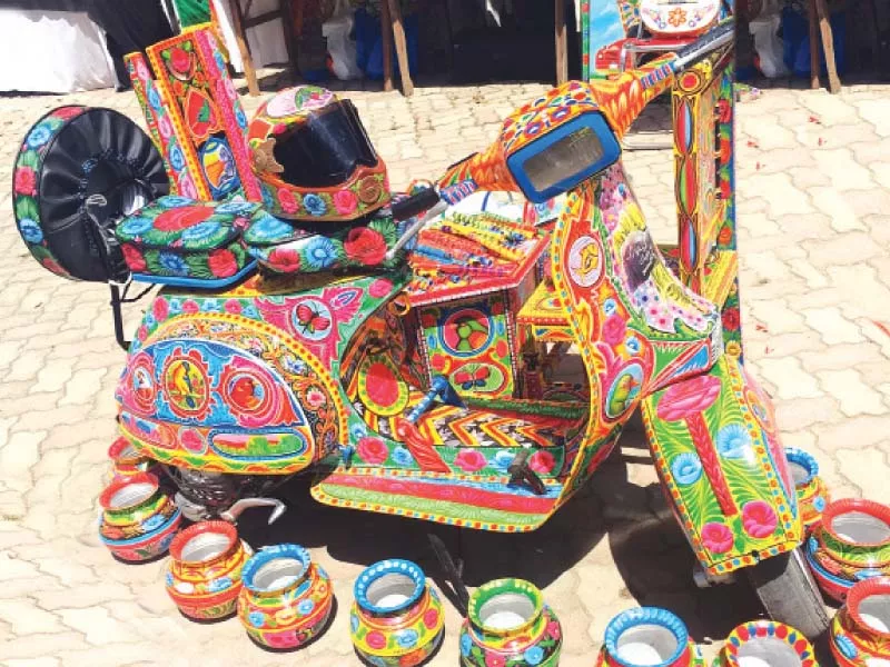 rehman putting the finishing detail on an item left a painted motorcycle helmet and some water pots right photos hafsah sarfraz express rehman putting the finishing detail on an item left a painted motorcycle helmet and some water pots right photos hafsah sarfraz express