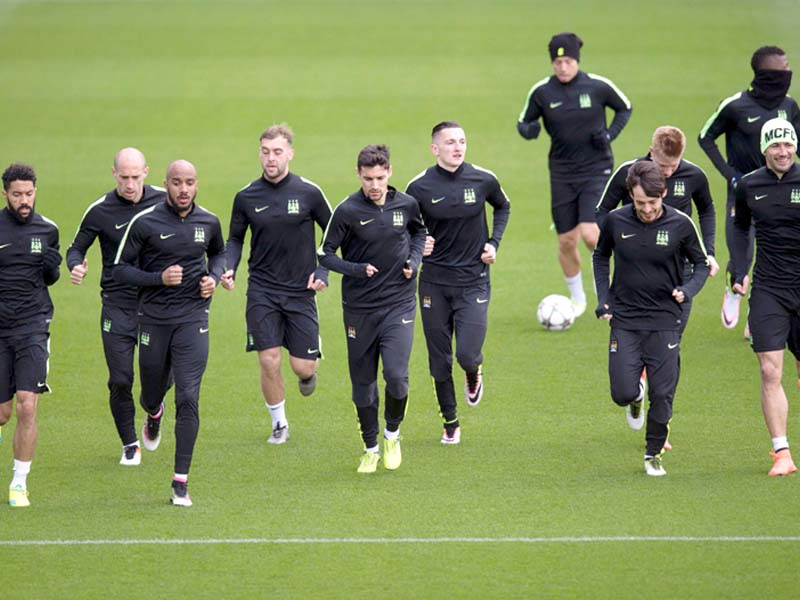 city s players take part in a team training session in manchester yesterday before heading to paris for their clash with psg photo afp