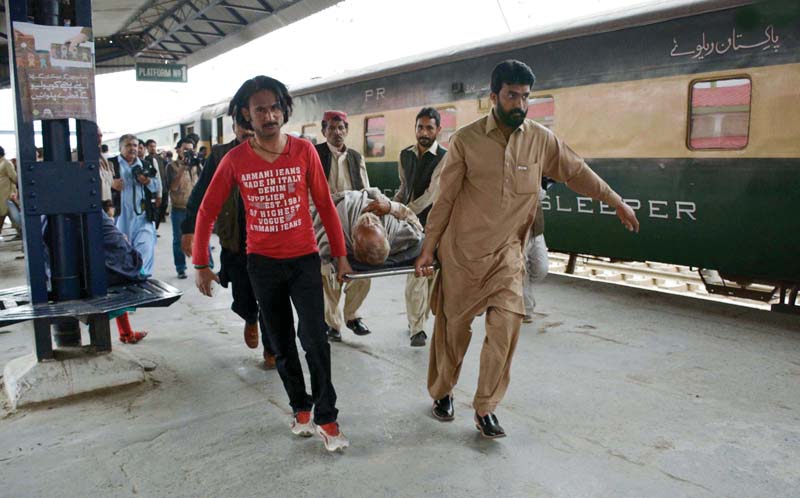 rescuers shift a victim to hospital after a bomb tore through the jaffar express near sibi photo inp