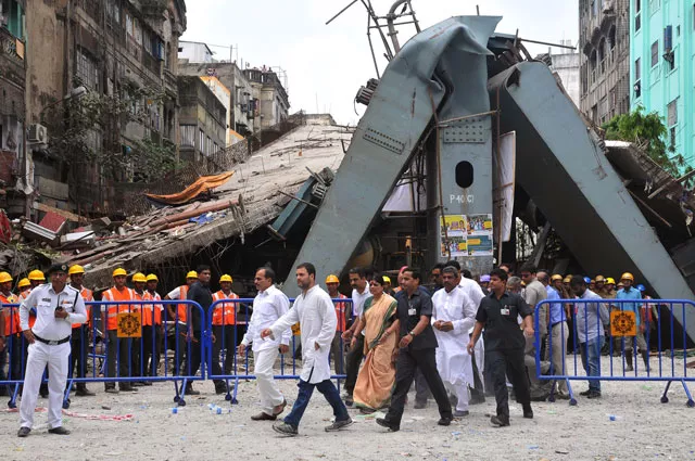 rahul gandhi centre l vice president of the all india congress committee and adhir ranjan chowdhury centre 2nd l state president for west bengal pradesh congress committee visit the site of a collapsed flyover in kolkata on april 2 2016 photo afp rahul gandhi centre l vice president of the all india congress committee and adhir ranjan chowdhury centre 2nd l state president for west bengal pradesh congress committee visit the site of a collapsed flyover in kolkata on april 2 2016 photo afp