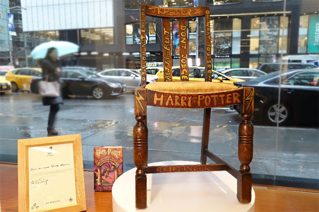 a chair used and later decorated by author j k rowling while she wrote the first two harry potter books on display alongside a letter of provenance from the author at heritage auctions in new york on april 4 2016 photo afp
