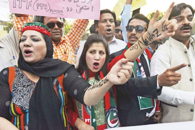 pti worker shout slogans against prime minister nawaz shairf during a protest in lahore photo afp