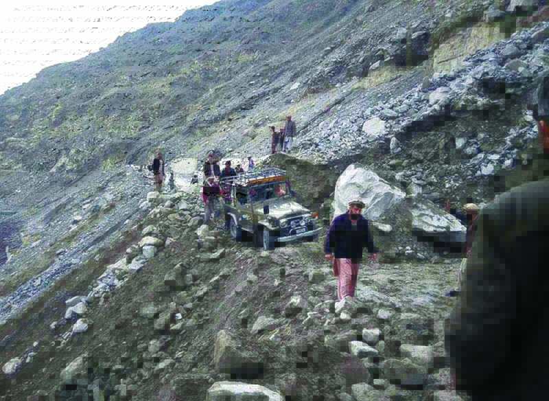a massive landslide has blocked this road near chilas forcing people to walk to their destinations photo online