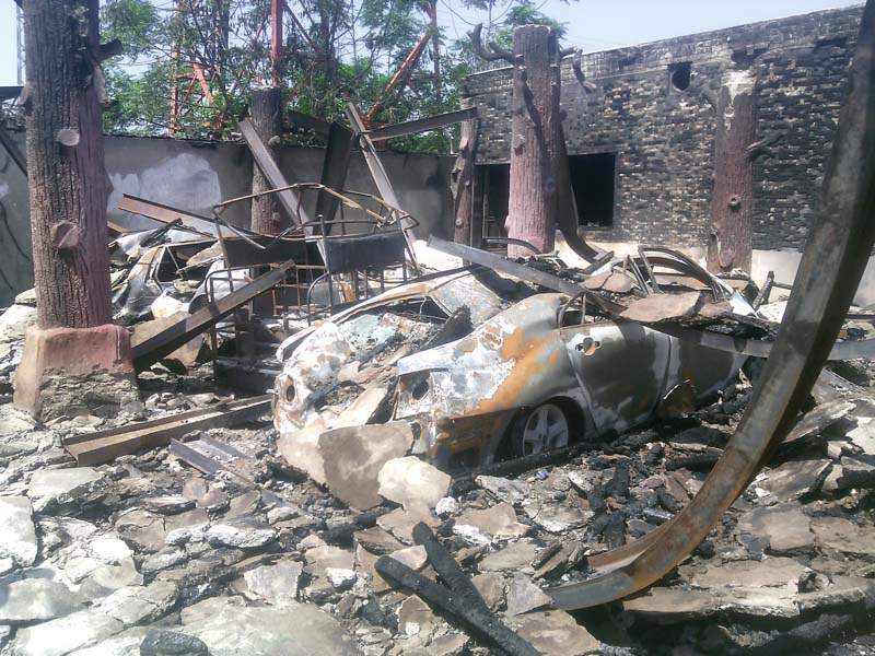 the damaged vehicles at the guesthouse photo express