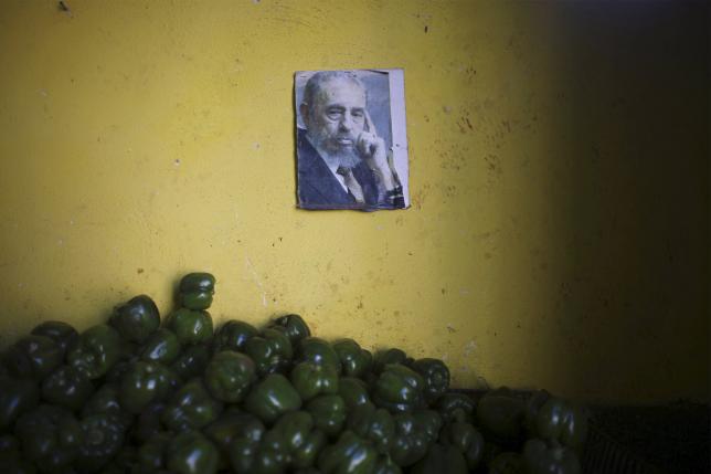 a photograph of cuba 039 s former president fidel castro decorates a wall inside a state run market in havana march 8 2016 photo reuters