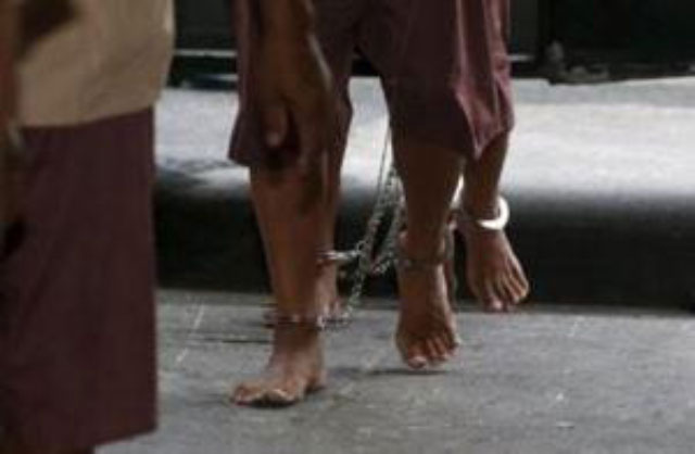 the shackled legs of suspected human traffickers are seen as they arrive for their trial at the criminal court in bangkok thailand in this file photo dated march 15 2016 photo reuters