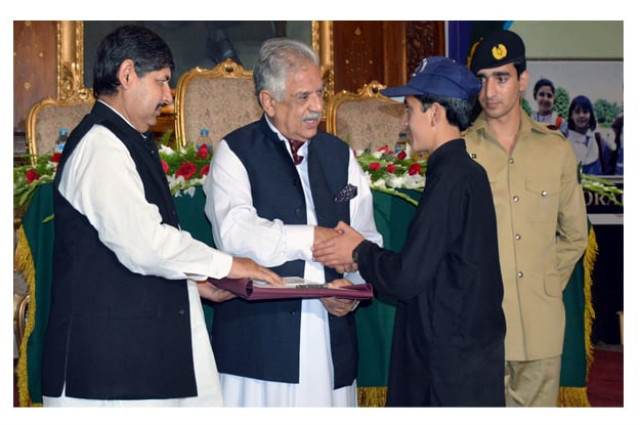 governor iqbal zafar jhagra awarding certificate to fata position holder student during the ceremony photo inp governor iqbal zafar jhagra awarding certificate to fata position holder student during the ceremony photo inp