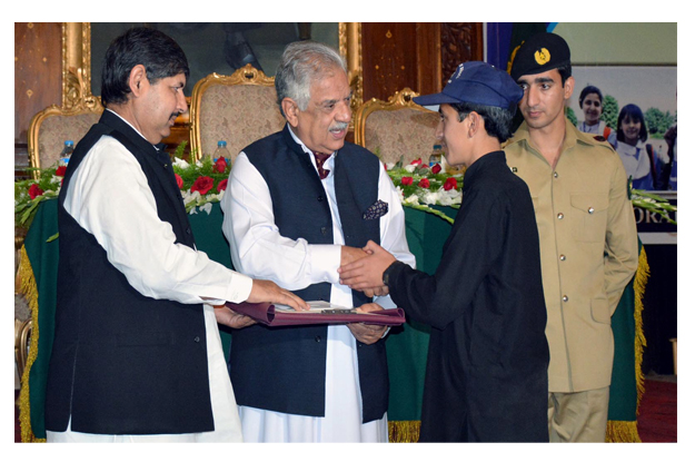 governor iqbal zafar jhagra awarding certificate to fata position holder student during the ceremony photo inp