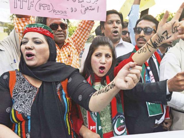 pti worker shout slogans against prime minister nawaz shairf during a protest in lahore photo afp