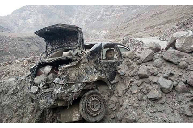 a view of destroyed car by landslide and flash floods following heavy rains in gilgit baltistan photo online