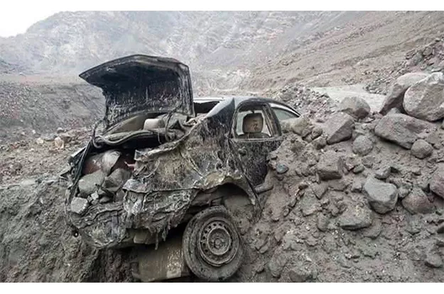 a view of destroyed car by landslide and flash floods following heavy rains in gilgit baltistan photo online a view of destroyed car by landslide and flash floods following heavy rains in gilgit baltistan photo online