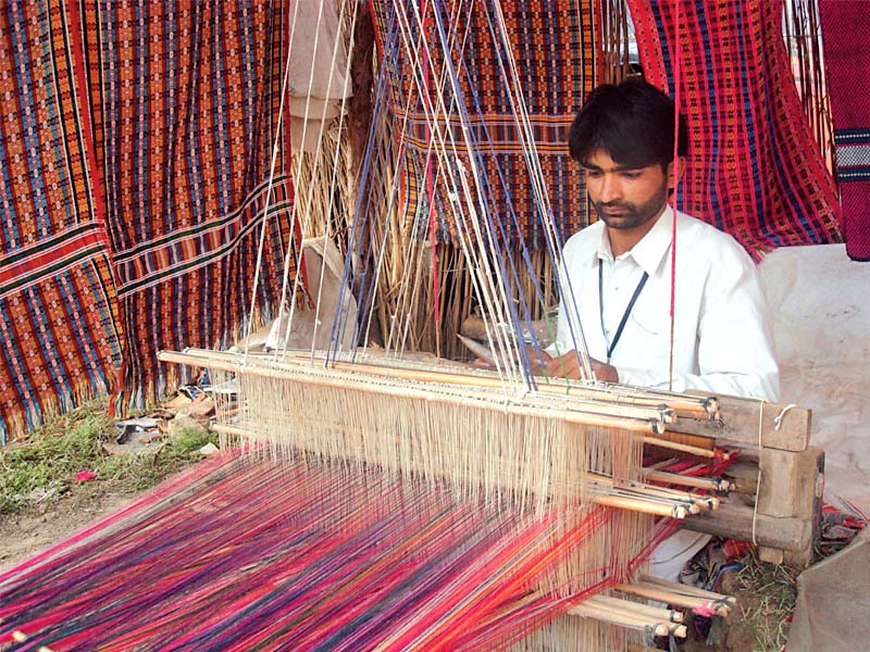 fabric made from traditional methods is expensive compared to the power loomed khaddar photo file