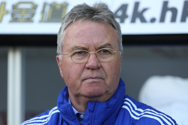 guus hiddink watches his players warm up ahead of the english premier league football match between swansea city and chelsea at the liberty stadium in swansea south wales on april 9 2016 photo afp