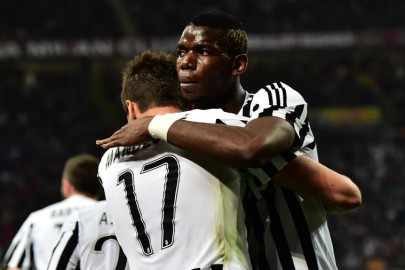 pogba winner at milan as juve march on