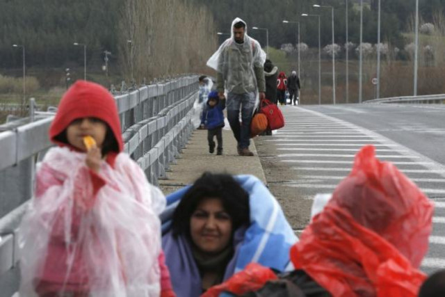 migrants walk along a road towards a makeshift camp at the greek macedonian border near the greek village of idomeni greece march 4 2016 photo reuters migrants walk along a road towards a makeshift camp at the greek macedonian border near the greek village of idomeni greece march 4 2016 photo reuters
