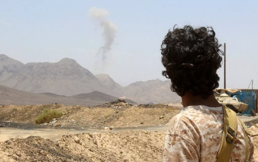 a yemeni fighter loyal to exiled president abedrabbo mansour hadi looks at smoke rising in the distance in the sirwah area in marib province on april 10 2016 photo afp a yemeni fighter loyal to exiled president abedrabbo mansour hadi looks at smoke rising in the distance in the sirwah area in marib province on april 10 2016 photo afp