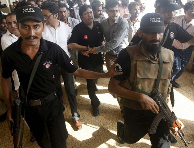 shoaib ahmed shaikh center the chief executive of axact was escorted from a court appearance last may photo reuters