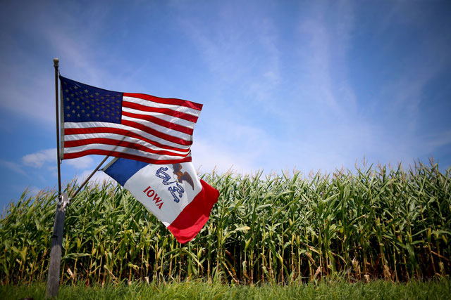 us and iowa state flags are seen next to a corn field in grand mound iowa united states in this august 16 2015 file photo photo reuters