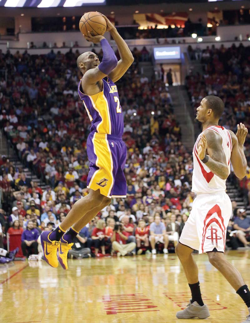 los angeles lakers bryant shoots over houston rockets ariza at the toyota center yesterday photo afp