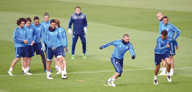 real players train on the eve of their champions league second leg against wolfsburg where they must overcome a two goal deficit to progress to the semi finals photo afp