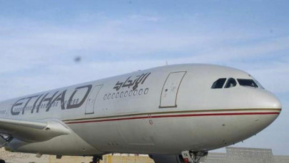 etihad flight stops on runway to allow passengers to rush to dying grandson