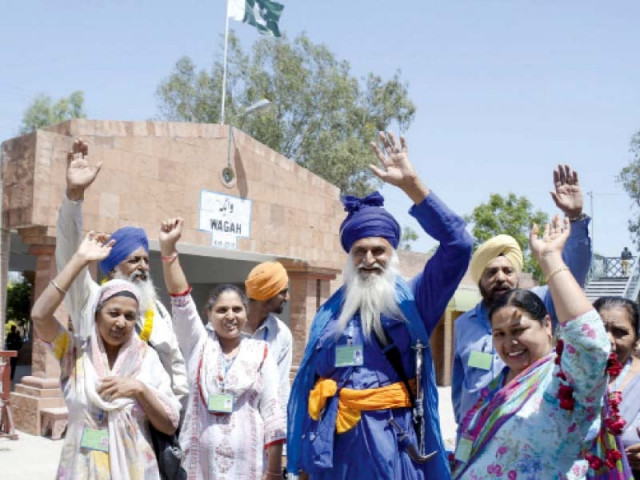 pilgrins wave at the camera on their arrival at the wagha border photo abid nawaz express pilgrins wave at the camera on their arrival at the wagha border photo abid nawaz express