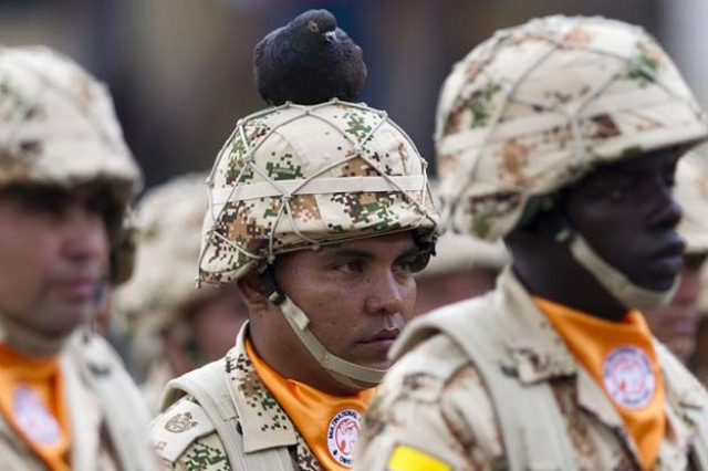 colombian infantry soldiers to be deployed as the multinational force and observers peacekeeping force in the sinai peninsula take part in a military ceremony at bolivar square in bogota colombia on april 03 2013 photo afp colombian infantry soldiers to be deployed as the multinational force and observers peacekeeping force in the sinai peninsula take part in a military ceremony at bolivar square in bogota colombia on april 03 2013 photo afp