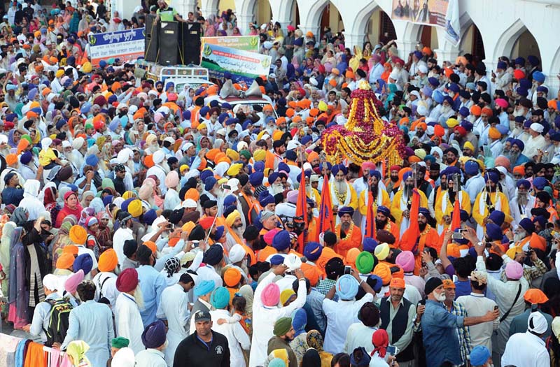 sikh devotees attend the baisakhi festival at gurdwara panja sahib in hassanabdal photo online file