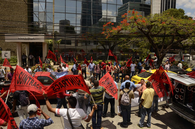 members of the construction workers union demonstrate outside mossack fonseca headquarters at panama city on april 13 2016 photo afp