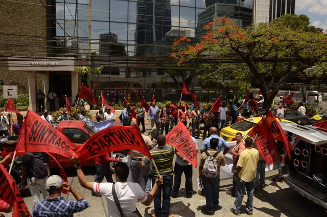 members of the construction workers union demonstrate outside mossack fonseca headquarters at panama city on april 13 2016 photo afp members of the construction workers union demonstrate outside mossack fonseca headquarters at panama city on april 13 2016 photo afp