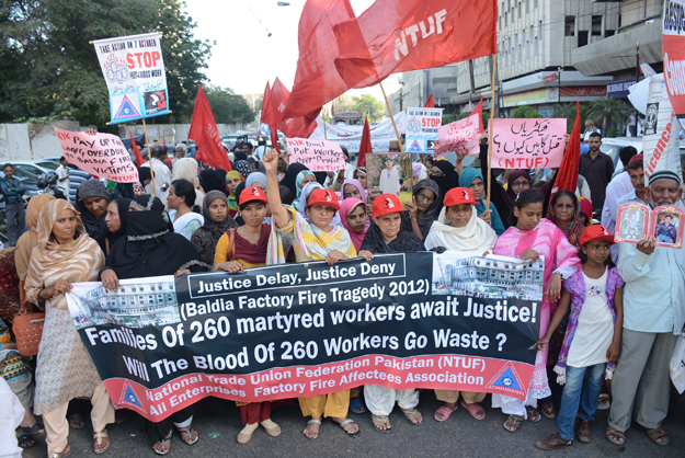 demonstrators demand justice and compensation in worst industrial disaster of pakistan photo express