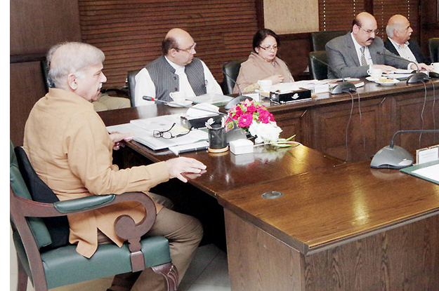 cm chairing a meeting to review ongoing development projects photo nni