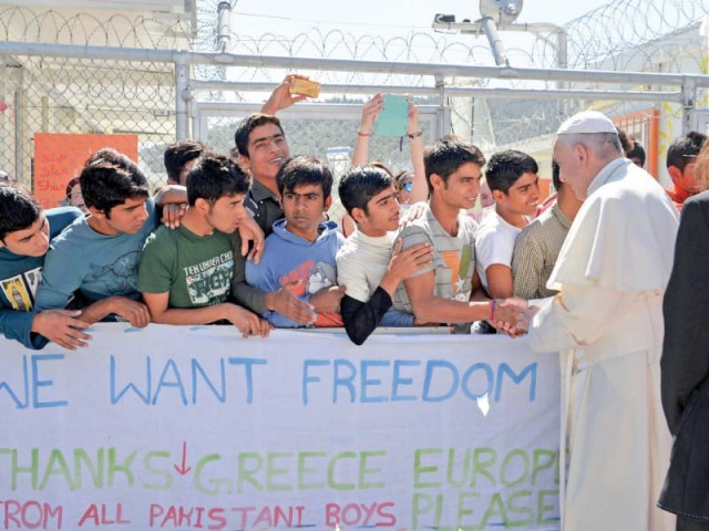 pope francis meeting young migrants from pakistan during a visit at moria refugee camp near the port of mytilene on the greek island of lesbos photo afp pope francis meeting young migrants from pakistan during a visit at moria refugee camp near the port of mytilene on the greek island of lesbos photo afp