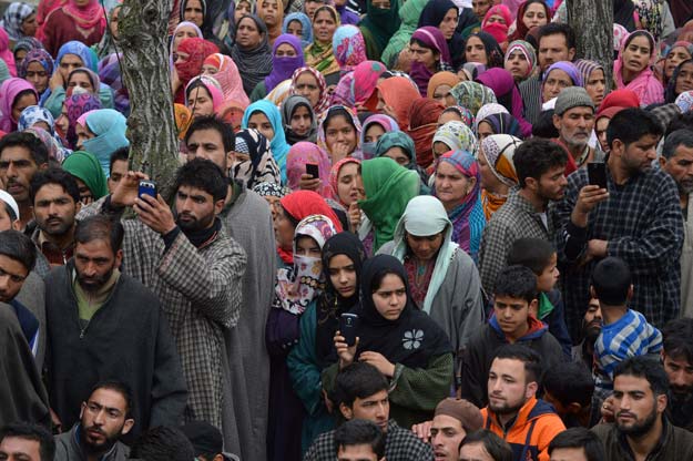 in this photograph taken on april 6 2016 kashmiri villagers gather during the funeral of suspected militant bilal ahmed bhat in the village of karimabad in pulwama district south of srinagar photo afp