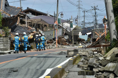 rescuers race against landslides to reach japan quake victims