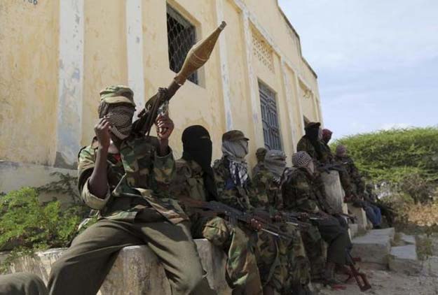 al shabaab soldiers sit outside a building during patrol along the streets of dayniile district in southern mogadishu march 5 2012 reuters