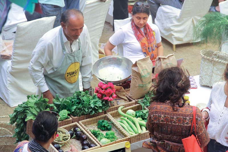 the karachi farmers market set up every sunday morning at haque academy in dha offers fresh vegetables farm eggs varieties of honey plants sherbet bread and milk among other items photo ayesha mir express