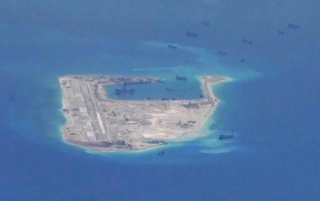 chinese dredging vessels are purportedly seen in the waters around fiery cross reef in the disputed spratly islands in the south china sea photo reuters