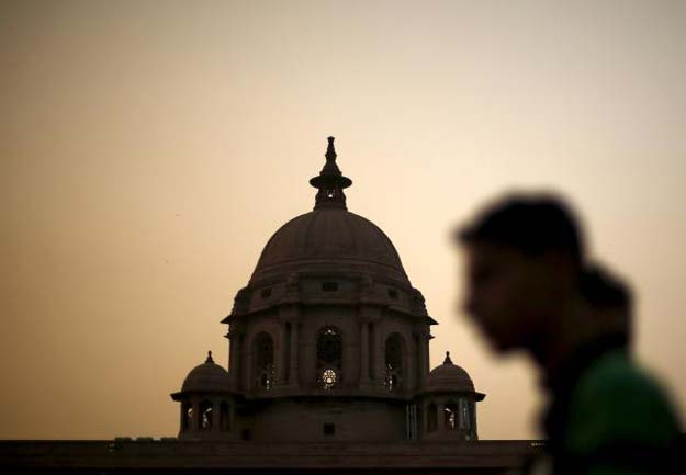 a commuter walks past the building of india 039 s ministry of finance during dusk in new delhi india in this may 18 2015 file photo reuters