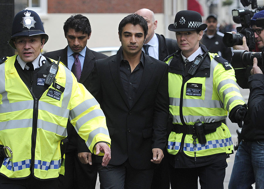 salman butt being given a police escort in london on march 17 2011 photo afp