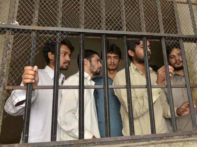 arrested gang members of a sexual abuse scandal stand in the police lockup in hussain khanwala village some 55 kms southwest of lahore on august 9 2015 photo afp