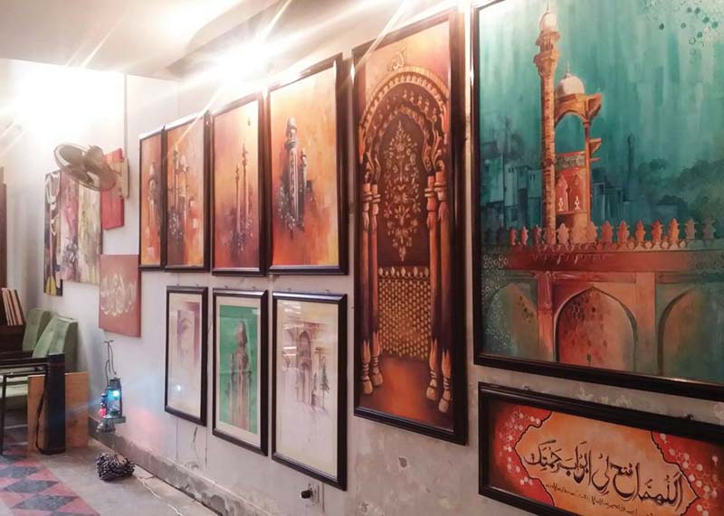 left art on display at shuhada e aps library hall in the city right one of the paintings exhibited photos hidayat khan express