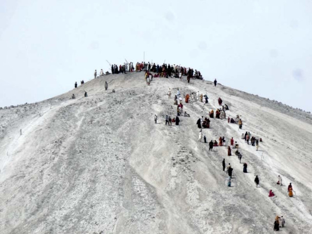 pilgrims make their way to the top of chandergup mud volcano in hingol photo ali xafar express pilgrims make their way to the top of chandergup mud volcano in hingol photo ali xafar express