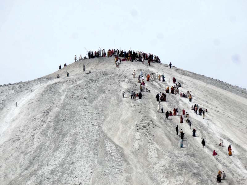 pilgrims make their way to the top of chandergup mud volcano in hingol photo ali xafar express
